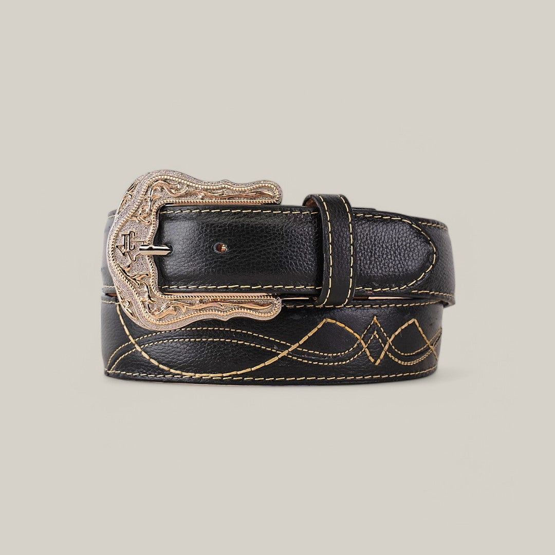 The Barcelona Black Belt - Texas Buckle features intricate yellow stitching, engraved patterns on a decorative buckle, and showcases its detailed craftsmanship coiled against a plain light gray background—ideal for any modern wardrobe.