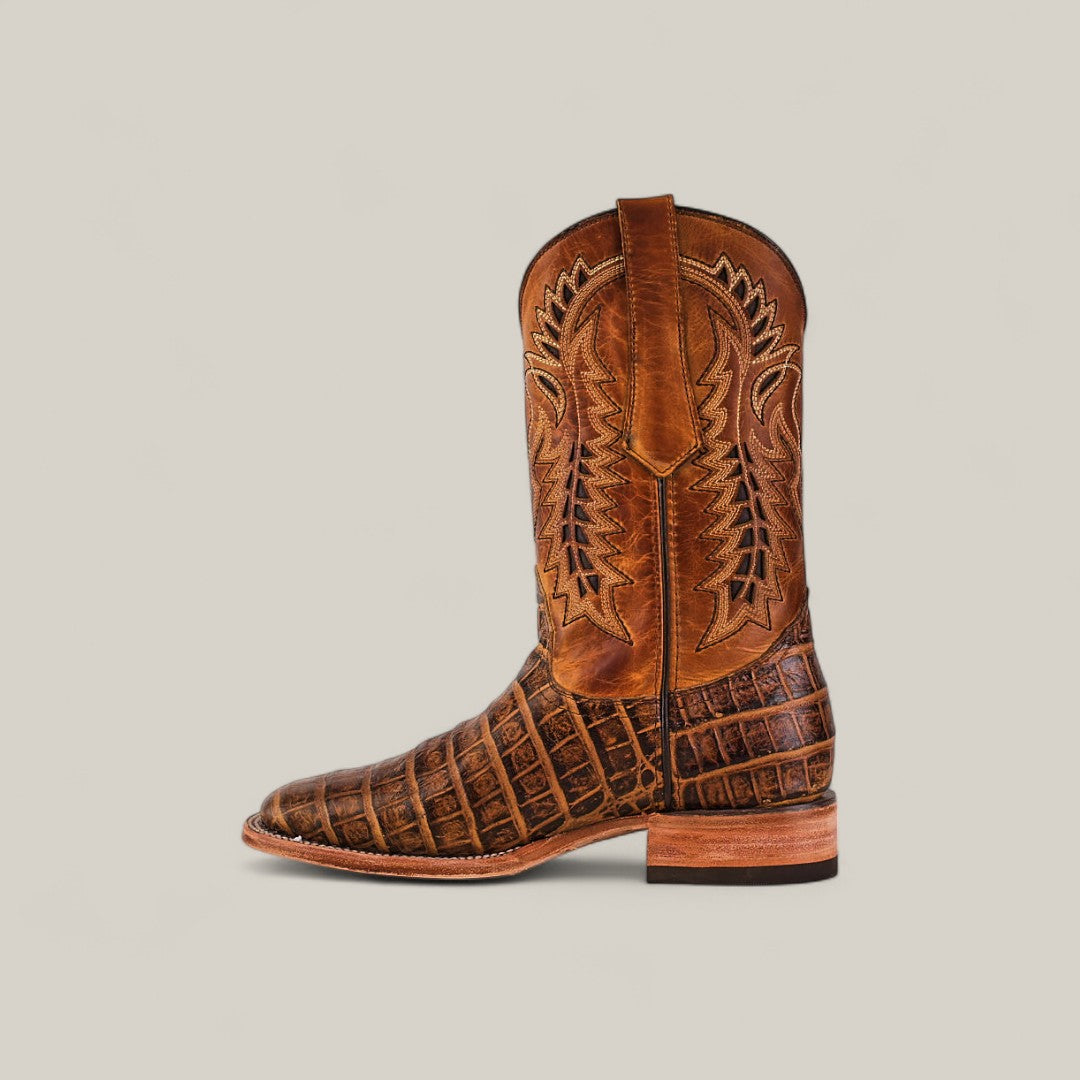 The Ross - Orix - Square Toe boot features a brown leather design with intricate upper shaft stitching and a textured, crocodile-like pattern on the foot, displayed against a plain light background.
