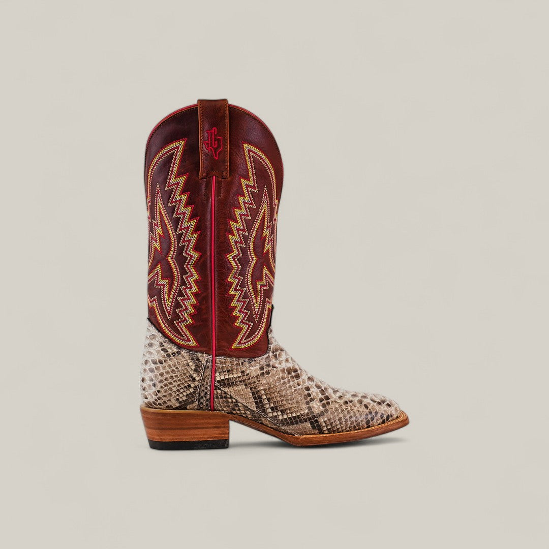 The Exotic Python - Natural - Square Toe is a stylish cowboy boot featuring tan and brown snakeskin, a wooden heel, and a maroon leather upper with vibrant yellow and red embroidery from the Platinum Collection.