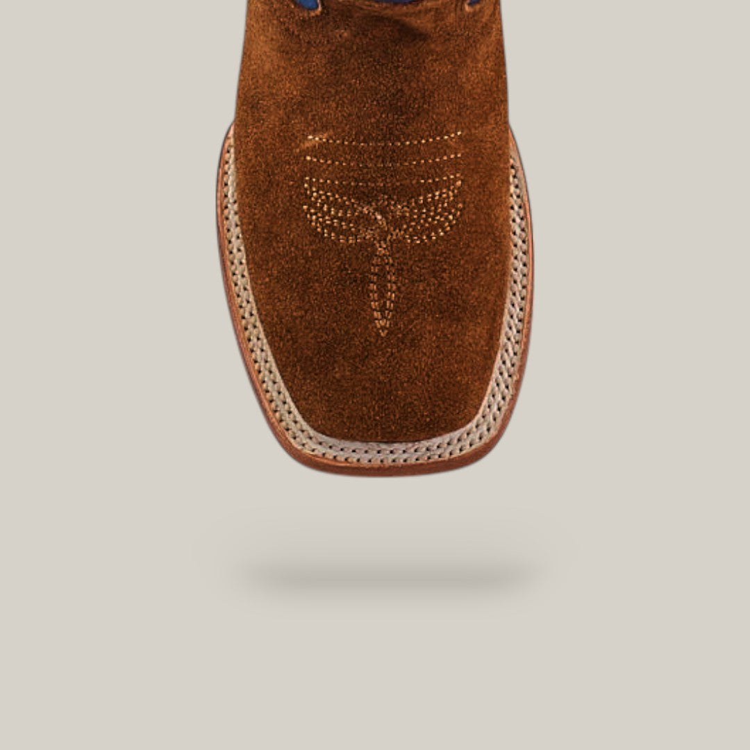 The Diamond Suede Ocre - Square Toe - Kids boot is brown with a square toe, white decorative stitching, and a white-trimmed edge, shown against a plain light gray background.