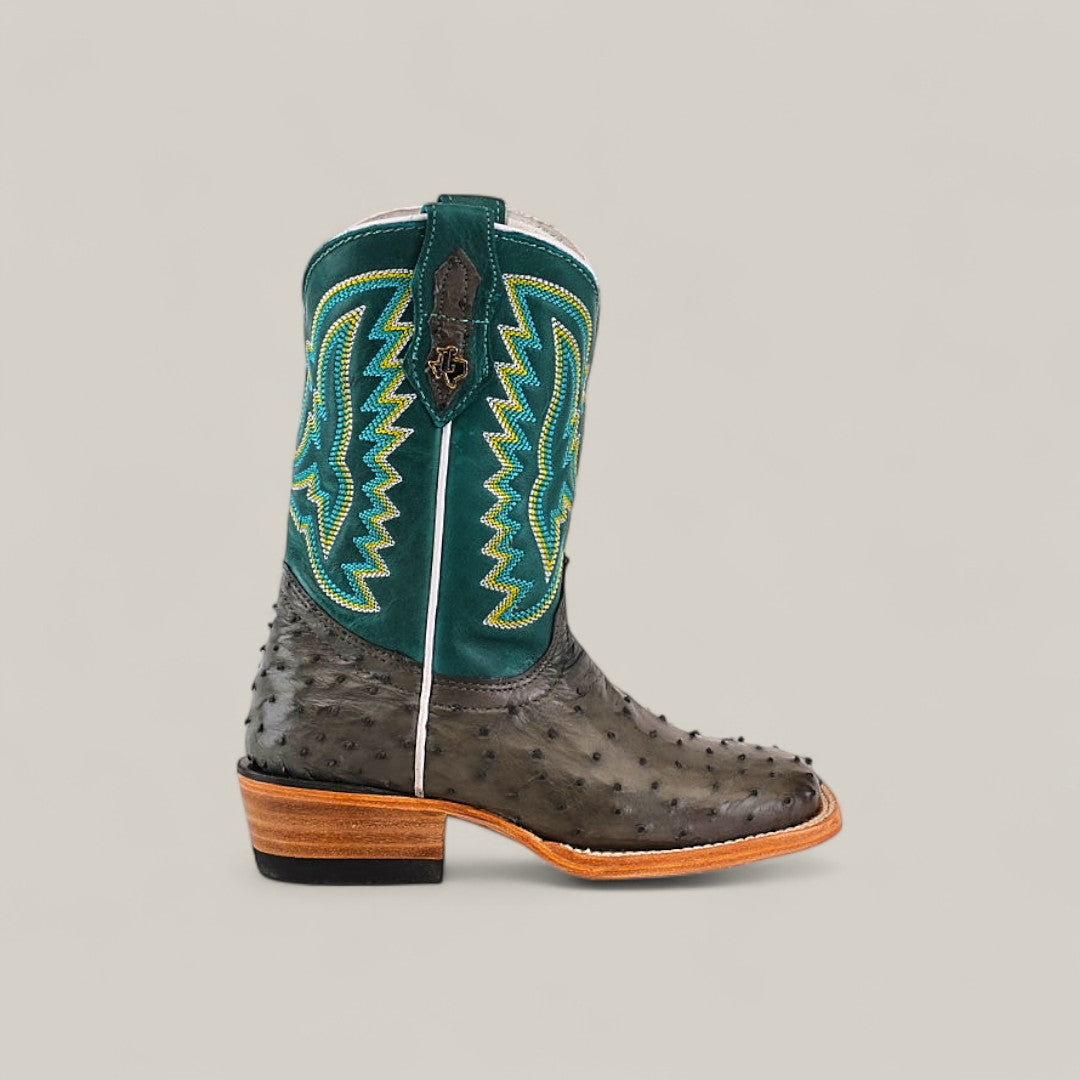 The Exotic Full Quilt Ostrich Gray Square Toe Kids Boot features a gray ostrich pattern, square toe, and durable sole, showcasing western style on a light background.