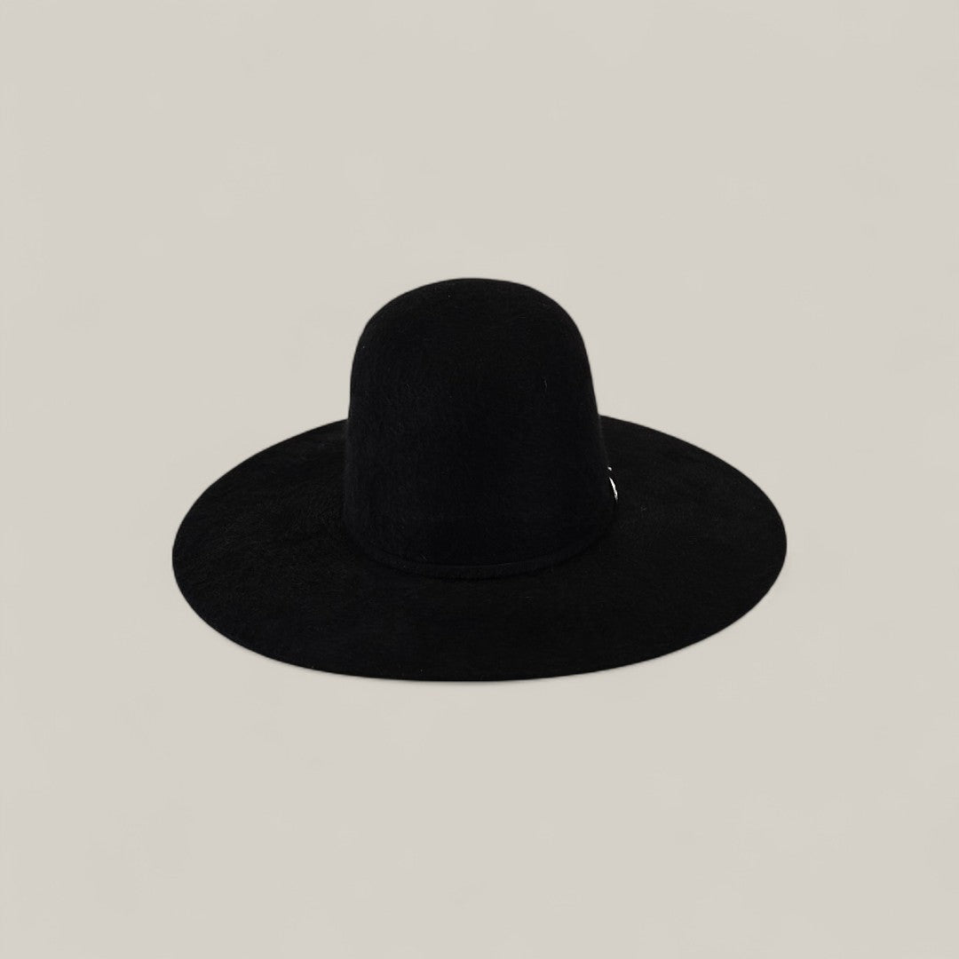 The 10X Grizzly - Tacchino is a wide-brimmed black felt hat with a rounded crown, crafted from premium materials and shown against a plain light gray background—an elegant open crown design.