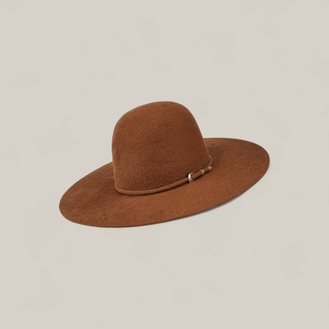 The 10X Grizzly - Tacchino is a luxury wide-brimmed brown felt hat with a rounded crown and thin band with metallic detail, shown against a plain light background.