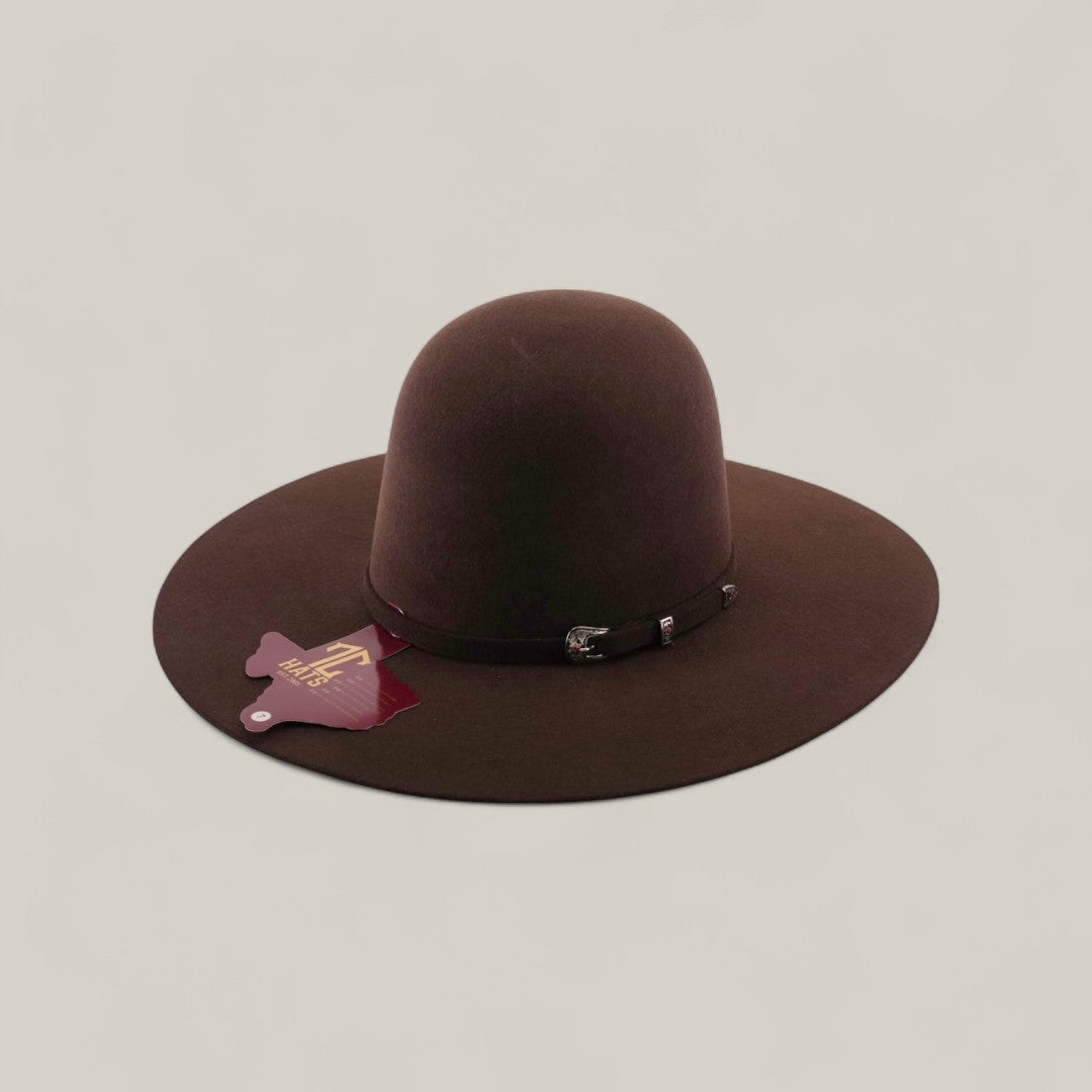 The 4X - Chocolate - TC Hat is a felt Western hat in dark brown, with a wide brim, simple black band, and attached tag, shown against a plain light background.