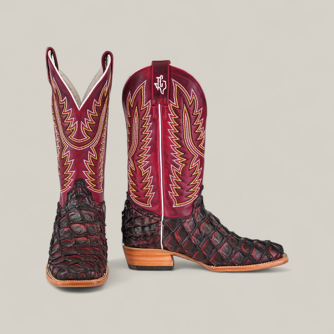 The Maverick - Wild Cherry - Square Toe boots feature exotic Pirarucu fish leather on the foot and heel, maroon leather shafts with yellow and red stitching, a square toe design, all shown on a light grey background.
