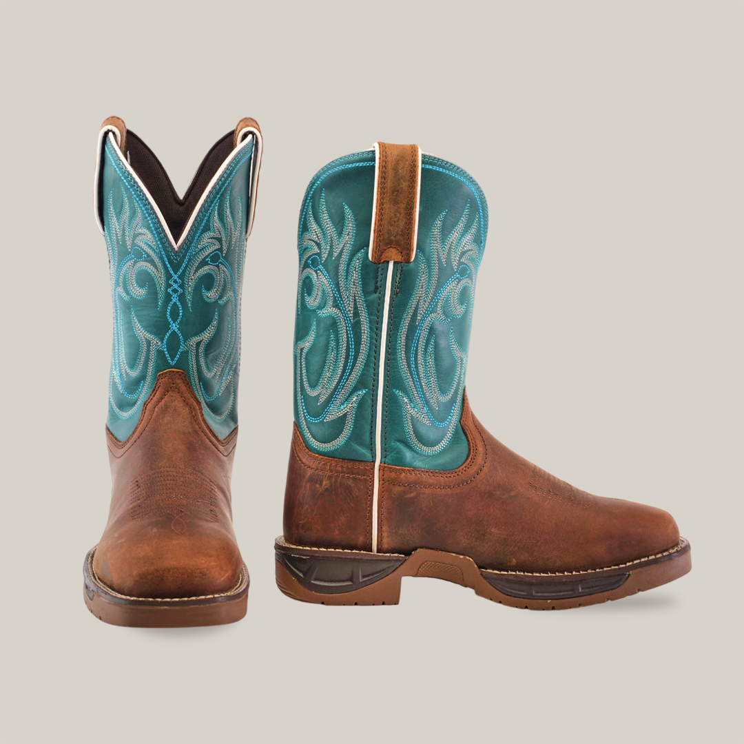 The Rustic Turquoise Brown boots are handcrafted with brown premium cowhide leather foot, a turquoise shaft, and intricate white stitching. One boot faces forward while the other side highlights the pull tab and exquisite design.