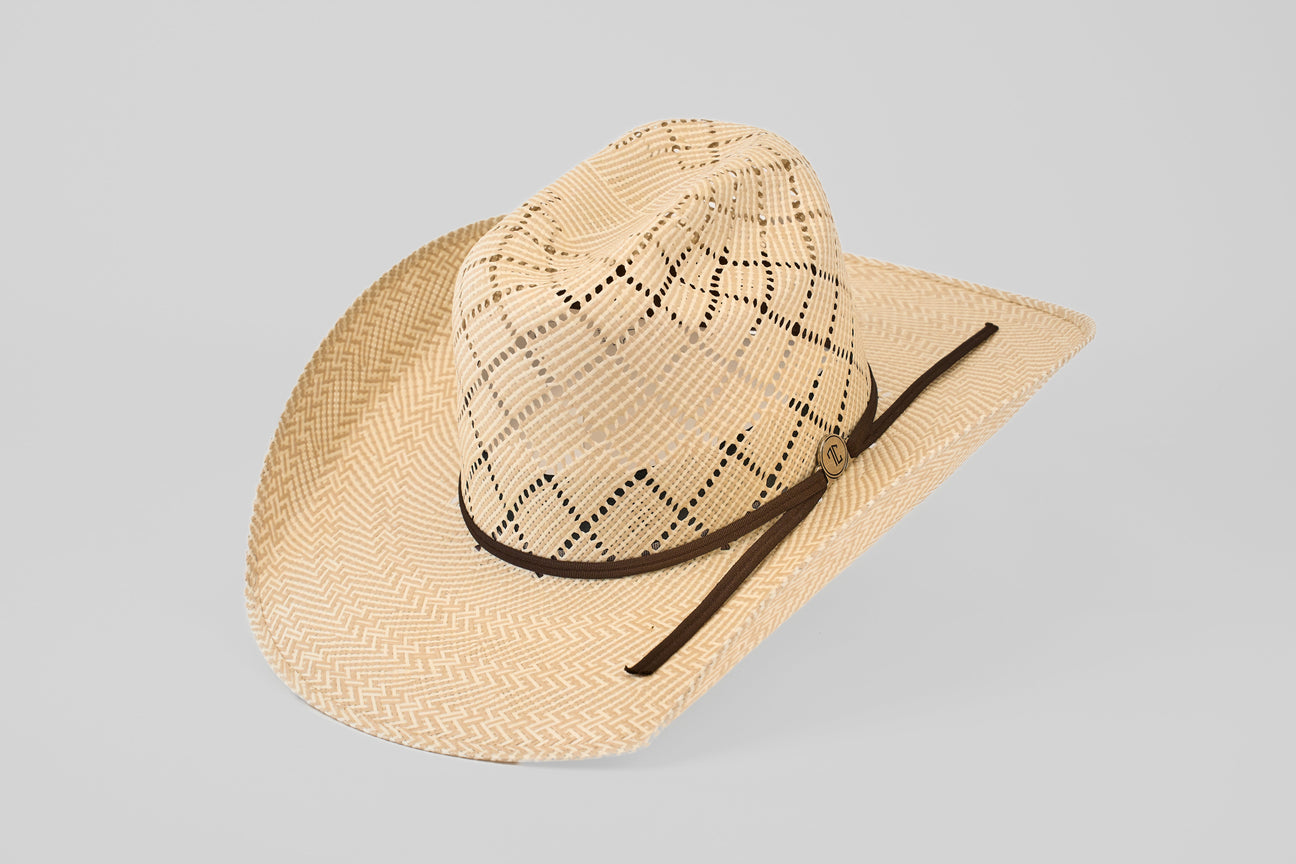 A light tan woven cowboy hat with a dark brown band and decorative patterns, set against a plain light gray background.