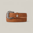 The Honey Plain Belt - Rustic Buckle, a handcrafted leather belt with an ornate engraved metal buckle, is rolled and displayed on a beige background, exuding timeless style.