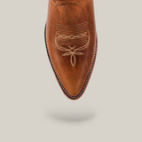 The Fresno - Fawn - Snip Toe boot features premium brown leather, a pointed snip toe, and detailed beige stitching, shown on a light beige background with a subtle shadow, showcasing authentic cowhide craftsmanship.