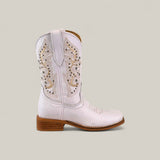 The Amara White - Square Toe - Kids Boot, crafted from premium materials with tan embroidery and a low wooden heel, is displayed against a plain beige background.