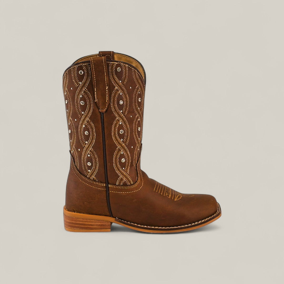 The Premiere Texas Copper - Square Toe Kids Boot features brown leather with decorative white stitching and a low wooden heel, shown in profile facing left against a plain light background.