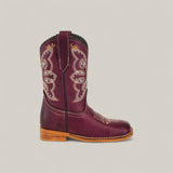 The Blake Purple - Square Toe Kids Boot features maroon leather, beige and gold embroidery, a brown stacked heel, and contrast toe stitching. Displayed in side profile against a plain light background for a trendy look.