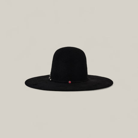 The 10X Grizzly - Tacchino is a wide-brimmed black felt hat with a rounded open crown and a small red accent on the band, shown against a simple beige background.