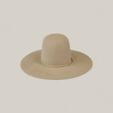 The 10X Grizzly - Tacchino is a wide-brimmed, light beige open crown felt hat with a rounded crown, shown against a plain off-white background.