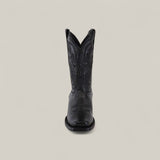 The Josie Full Black - Short Shaft - Narrow Square Toe boot is shown from the front, featuring decorative stitching and a classic black finish against a plain, light background for a chic look.