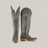 The Celine Gray - Tall Shaft - Snip Toe womens boots feature gray suede, decorative stitching, wooden heels, pointed toes, and a side zipper, shown against a plain beige background.