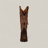 The Kellie Suede Brownie Leather Sole Tall Shaft Snip Toe boot is shown from the front, featuring dark brown suede and detailed light tan embroidery on a plain light background.