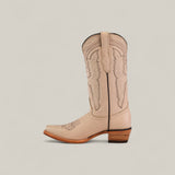 The Tessa Champagne Mid Shaft Snip Toe boot features light beige color, decorative stitching, a wooden stacked heel, and a pull tab—shown in profile against a light background—for women who value style and comfort.
