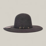 The 4X Gray - TC Hats is a wide-brimmed, dark gray Open Crown Texana felt hat with a rounded crown, featuring a thin decorative black band and small buckle, shown against a plain light background.