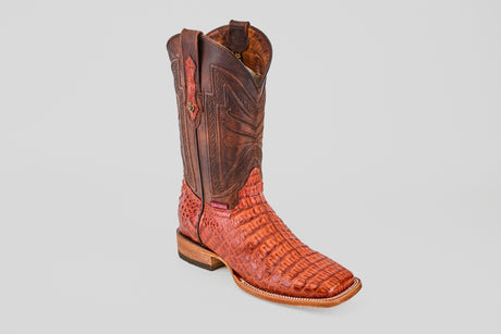 The Exotic Caiman Horn Back - Brandy - Square Toe boot features intricate stitching, a textured horn back pattern, square toe, and wooden heel, displayed singly on a plain light gray background.