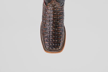 Close-up top view of the Exotic Caiman Horn Back - Roma boot, featuring brown textured caiman leather, a square toe, and detailed edge stitching, set against a plain white background.