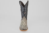 A single mens Exotic Full Quilt Ostrich - Nicotine - Square Toe boot with a textured light gray and black leather foot, black leather upper, decorative stitching, and Texas emblem, shown on a plain white background.