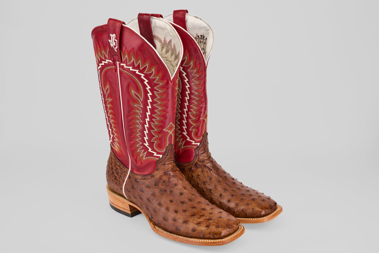 A pair of Thompson - Red / Brown - Square Toe boots from the Platinum Collection, with red and white stitching, tall shafts, wooden heels, and rounded toes, displayed on a light gray background.