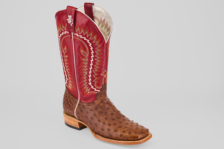 The Thompson - Red / Brown - Square Toe boot features a brown textured leather foot, a red shaft with white and gold stitching, and a white embroidered logo—part of the exclusive platinum collection.
