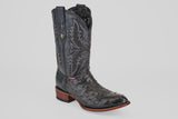 The Exotic Full Quilt Ostrich - Black - Round Toe boot, featuring decorative stitching, a textured ostrich leather foot, brown sole, and low wooden heel, is shown on a plain light gray background.