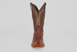 A single Exotic Full Quilt Ostrich - Brown - Square Toe boot made of textured leather with intricate stitching and a patterned toe and shaft, reminiscent of ostrich boots, is shown from the front against a plain light background.