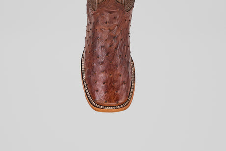 A close-up, top view of the Exotic Full Quilt Ostrich - Brown - Square Toe highlights its square toe, quilted ostrich pattern, and decorative edge stitching.