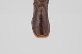 A close-up of the toe on the Austin Leg - Brown - Square Toe cowboy boot, featuring textured ostrich leather and detailed stitching, set against a plain light gray background.
