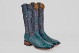 A pair of Austin - Gasoline Green - Square Toe ostrich leather cowboy boots with turquoise feet, dark blue shafts, decorative stitching, and wooden heels sits on a plain white background.