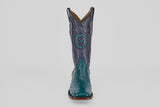The Austin - Gasoline Green - Square Toe men’s western boot features a teal ostrich leather foot and a dark blue shaft with star and circular stitching, shown from the front on a white background—ideal for ostrich leather boot enthusiasts.