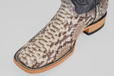 A close-up of the Tanner - Natural - Square Toe boot, showcasing a textured Python Natural snakeskin foot and a light-colored wood sole.