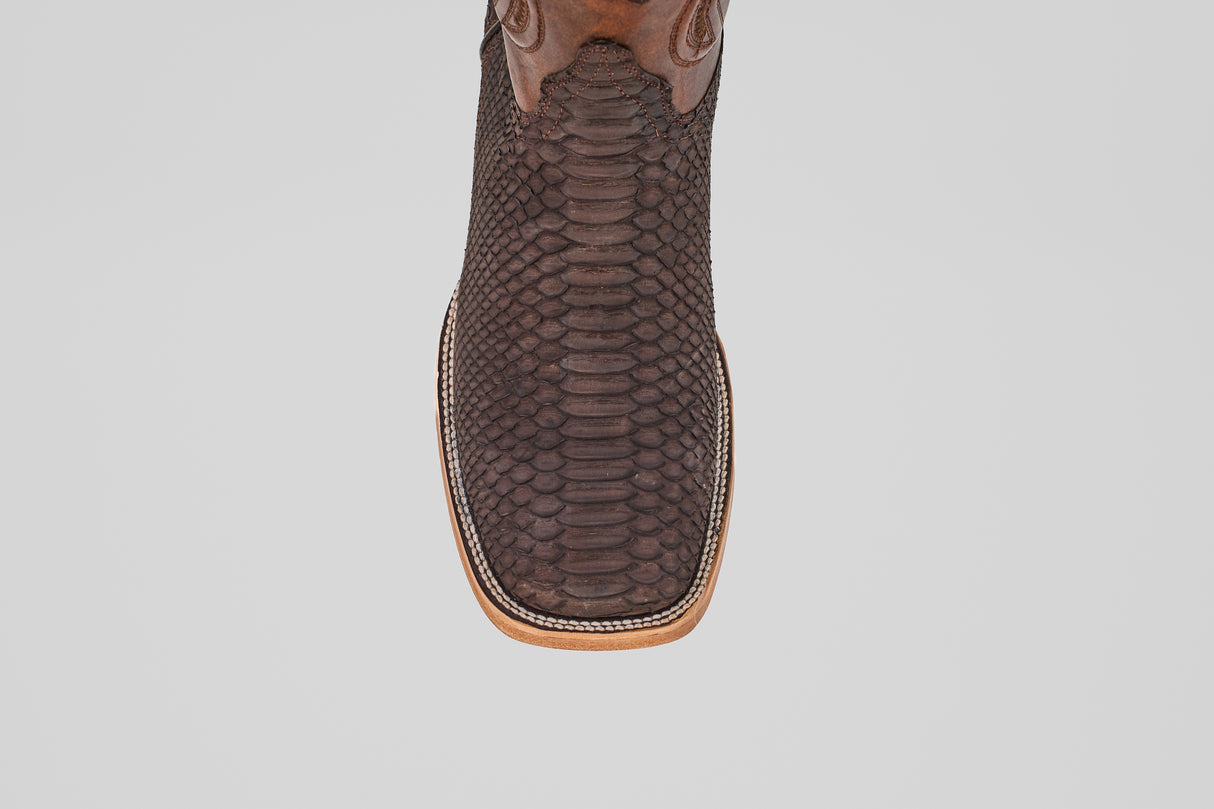 A close-up top view of the Tanner - Matte Brown - Square Toe cowboy boot, crafted in brown with a square toe and decorative stitching, set against a plain white background.