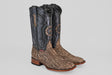 The Tanner - Rustic Bone - Square Toe cowboy boots feature dark black leather tops, brown snakeskin-patterned lowers, decorative stitching, and wooden heels—all displayed on a light gray background.