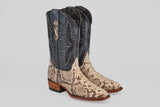 The Tanner - Natural - Roper Toe boots feature black leather uppers with decorative stitching, natural python-patterned lowers, wooden heels, and a subtle sheen—bringing a touch of Tacoma style.