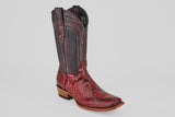 The Tanner – Ruby – Narrow Square Toe is a single western boot made of red and brown python leather with a narrow square toe, decorative stitching, and a wooden heel, displayed against a plain white background.