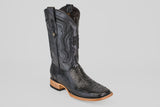 The Tanner - Black - Square Toe cowboy boot features a textured lower section, decorative stitching on the upper shaft, and a light brown wooden heel and sole, all set against a plain white background.