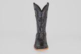 A single Tanner - Black - Square Toe cowboy boot in Python Negro leather, featuring decorative stitching and a wooden sole, is shown from the front against a plain light background.