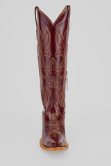 The Allison Blackberry - Tall Shaft - Snip Toe boot in dark brown features decorative stitching, a pointed toe, tan sole, and side zipper, shown upright against a gray background—ideal stylish Western boots for women.