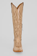 The Allison Cream - Tall Shaft - Snip Toe is a single tan boot with decorative stitching and a pointed toe, displayed upright against a light gray background. Ideal for women looking for stylish cowboy boots.
