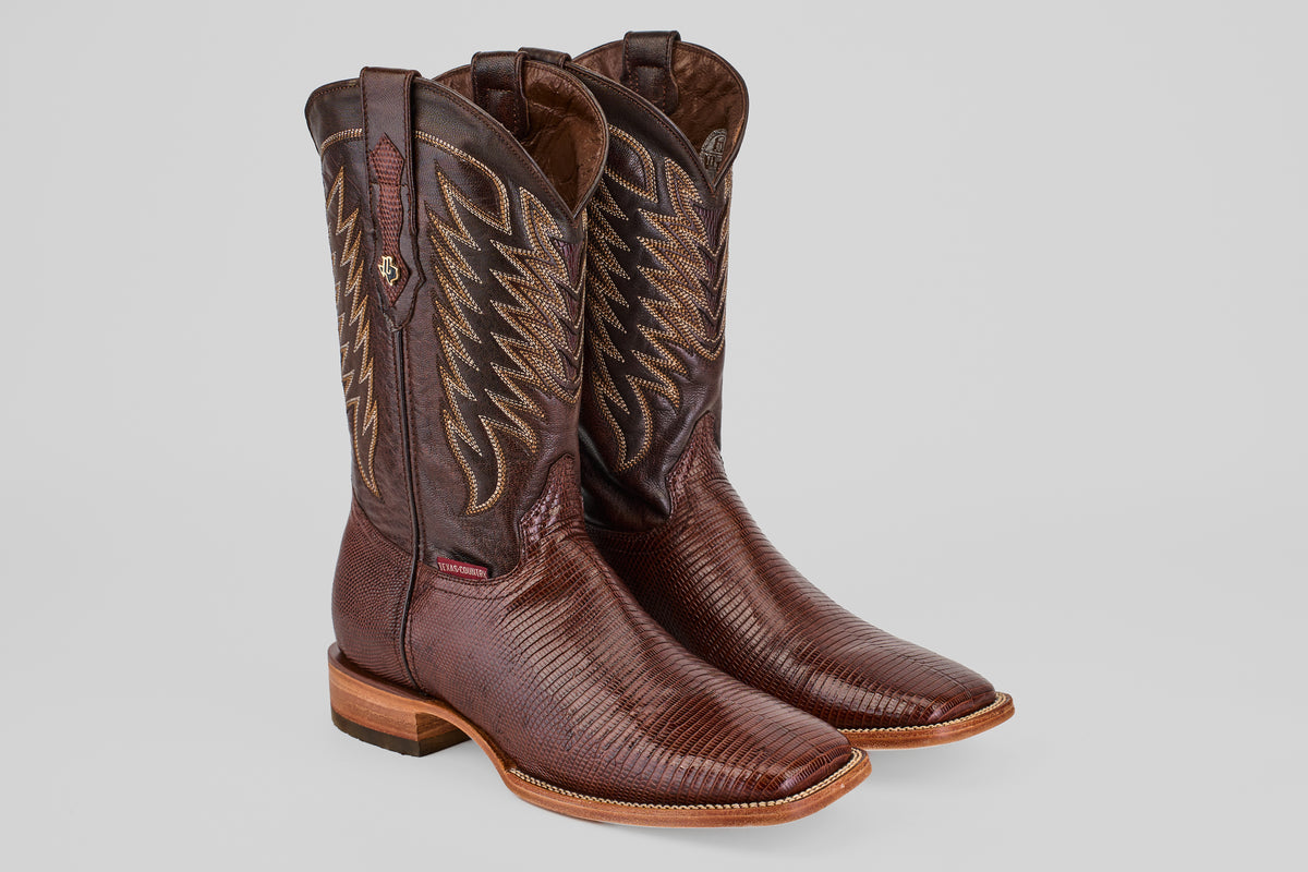 The Blaze – Brown – Square Toe Cowboy Boots feature decorative stitching on the shafts and a textured pattern on the feet, shown against a light gray background.