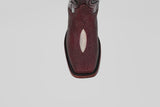 A close-up, top-down view of the Ranger – Wine – Rodeo Toe cowboy boot, showcasing its maroon stingray leather with a white diamond accent and classic rodeo toe, set against a plain light gray background.