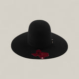 The 10X - Black - TC Hats features an open crown Texana Western style with a maroon Texas-shaped tag on the brim, an elegant decorative band, and is displayed against a light beige background.