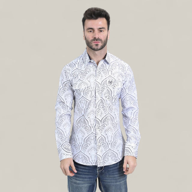 A man with short dark hair and a beard wears the Mens Western Modern Fit Cotton/Spandex Long Sleeve White Shirt with Snaps (WPL10822) and blue jeans, standing against a plain light beige background.