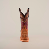 The Grecas Orix - Square Toe boot combines fashion and functionality with a premium leather design, brown lower, and purple embroidered upper adorned with floral patterns. This stylish boot features convenient pull straps, ideal for girls collections. Displayed on a white background.