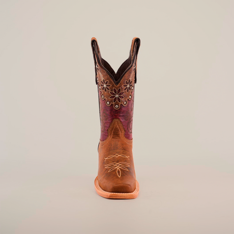 The Grecas Orix - Square Toe boot combines fashion and functionality with a premium leather design, brown lower, and purple embroidered upper adorned with floral patterns. This stylish boot features convenient pull straps, ideal for girls collections. Displayed on a white background.
