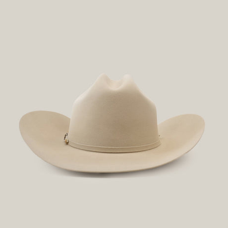 The 500X Superior Belly is a premium Western cowboy hat in light tan, crafted from 100% belly beaver fur. It features a wide brim and a teardrop-shaped crown, set against a plain white background.